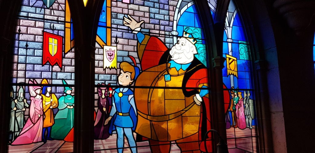 sleeping beauty castle disneyland paris story on the windows