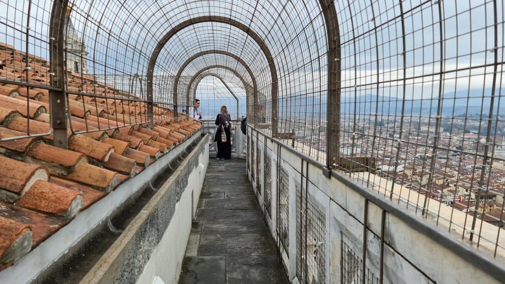 Exterior view from the top of Giotto's Bell Tower, showing the narrow, protected corridor that allows visitors to walk around the circumference and view Florence in all four directions.