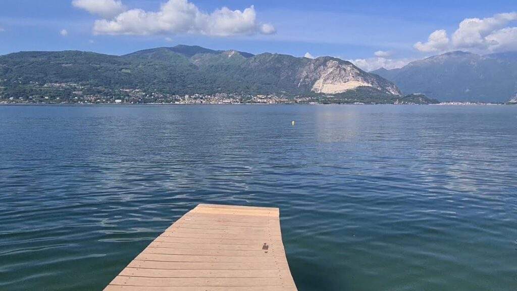 a dock on a lake. can you swim in lake maggiore