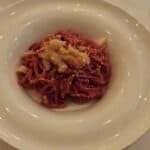 A plate of Tagliolini Rossi (red pasta) at Trattoria La Fiasca in Sirmione, Lake Garda. This is a must-try traditional dish at the restaurant.