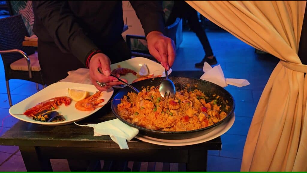Tenerife Nightlife Expert Guide: How to Find Your Perfect Bar & The Canary Islands Vibe 3 Traditional Spanish mixed paella dish served in a restaurant in Tenerife South.