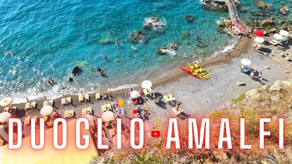 Duoglio Beach: Amalfi's Hidden Gem 4 Duoglio Beach, Amalfi Coast, hidden gem of Amalfi with crystal clear waters and beach loungers.