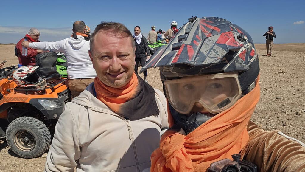 Marrakech Quad Biking: Thrills, Oasis Luxury & The City's Hidden Contrast 4 Ila and Gabriel ready for quad biking in Marrakech, showing essential scarf protection against desert dust.