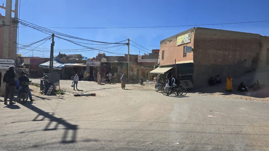 Marrakech Quad Biking: Thrills, Oasis Luxury & The City's Hidden Contrast 2 Marrakech Desert Tour: Glimpse of Moroccan rural life in a dusty village along the quad biking route.