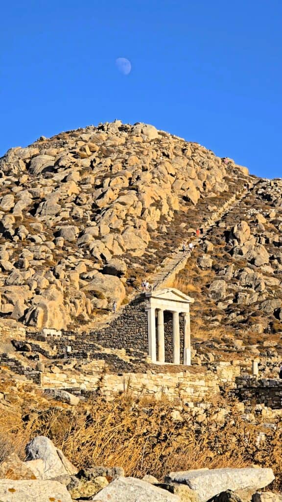 View of the staircase leading to the Cave of Hercules in Delos under the moonlight, Mykonos UNESCO site.