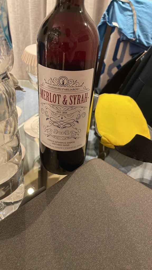Bottle of Greek red wine (Merlot & Syrah) provided at the hotel upon arrival in Rhodes, illustrating its light aperitif style.