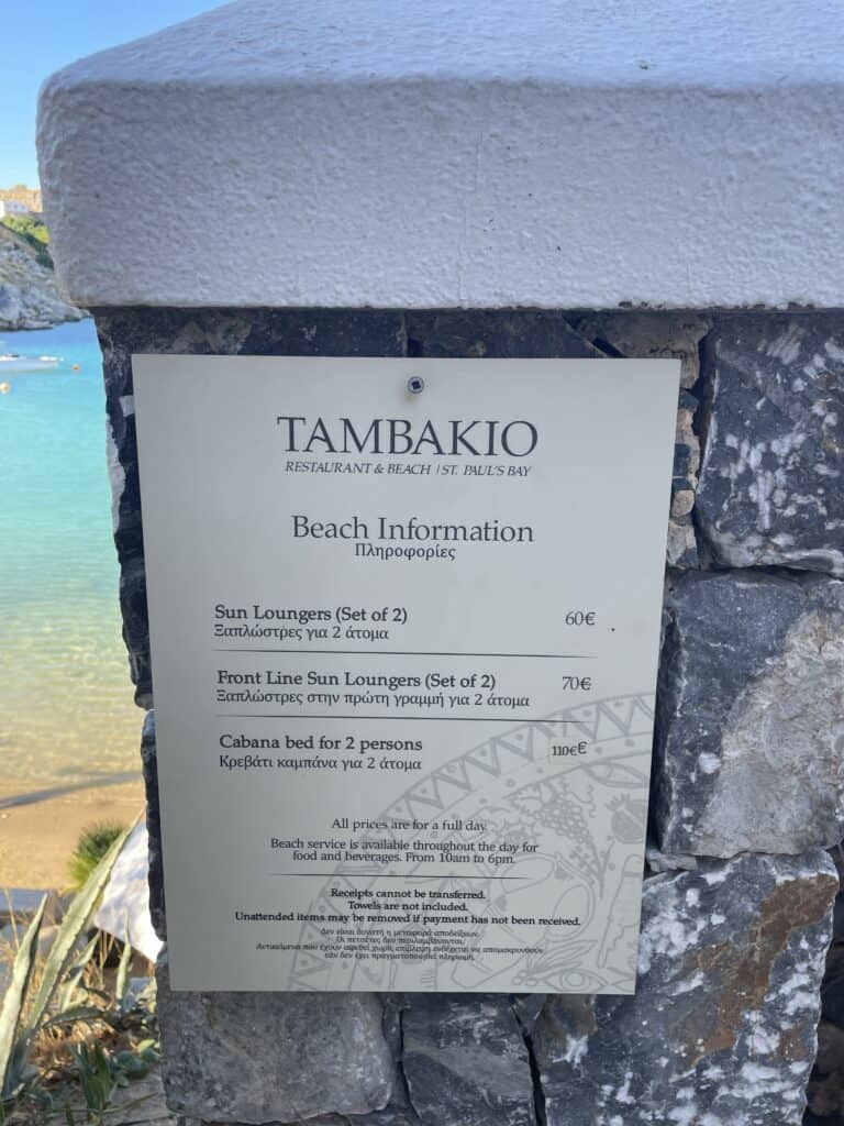 The price list for sunbed and umbrella rental at the premium Tambakio section of St. Paul's Bay, observed in October 2025. This confirms the notably higher price bracket for this exclusive location.