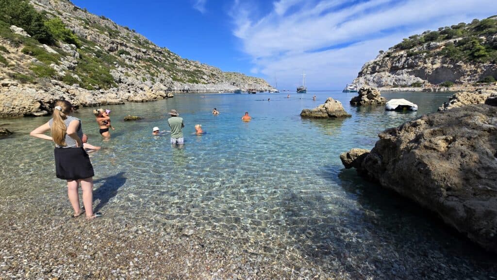 Anthony Quinn Bay, Rhodes: The Emerald Gem of the Aegean (Your 2025 Guide) 3 Crystal clear water at Anthony Quinn Bay Rhodes with boats and visible rocky seabed, perfect for snorkeling