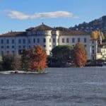 Close-up view of Palazzo Borromeo on Isola Bella, Lake Maggiore, highlighting the beautiful autumn foliage and architecture.