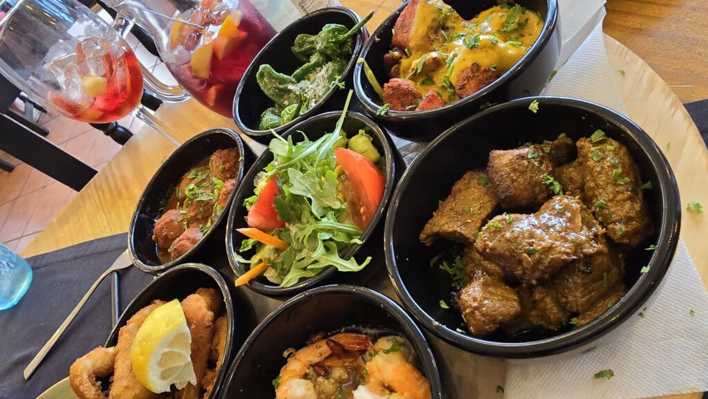 Friends Restaurant Los Cristianos tapas platter with various dishes for sharing in Tenerife South.