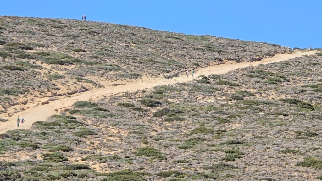Prasonisi Rhodes: Where Two Seas Meet (2026 Planning Guide & Prices) 2 Rough, dry path leading to the Prasonisi Lighthouse peninsula. Essential safety note for walking the isolated terrain.