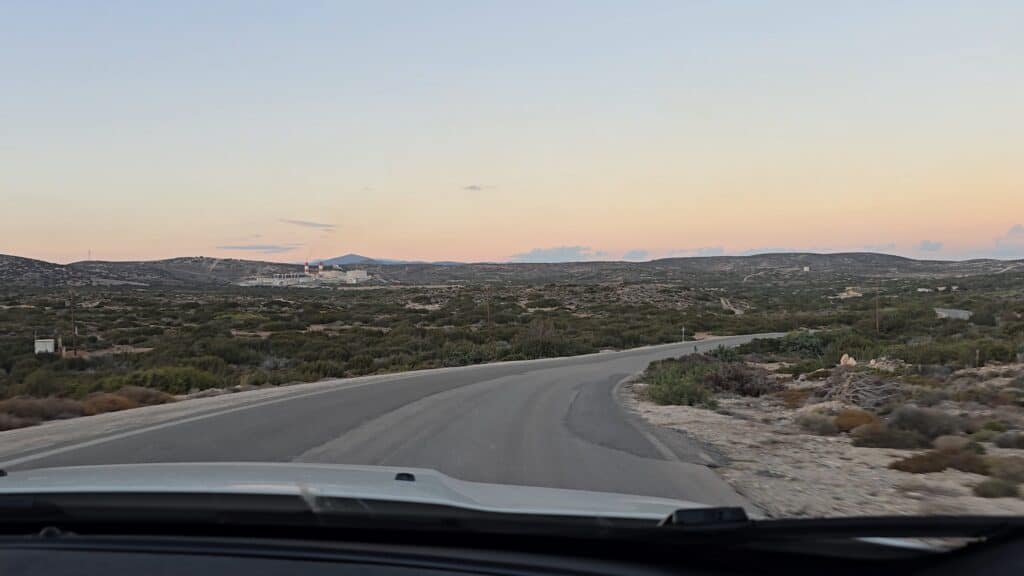 Prasonisi Rhodes: Where Two Seas Meet (2026 Planning Guide & Prices) 6 Driving on the road from Prasonisi at twilight. Visual proof that the isolated road lacks public streetlights.