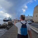 rhodes medieval walls fortress mandraki harbour cloudy day contrast