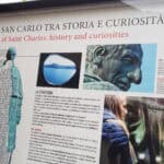 Information board and historical explanation displayed outside the Sancarlone entrance in Arona.