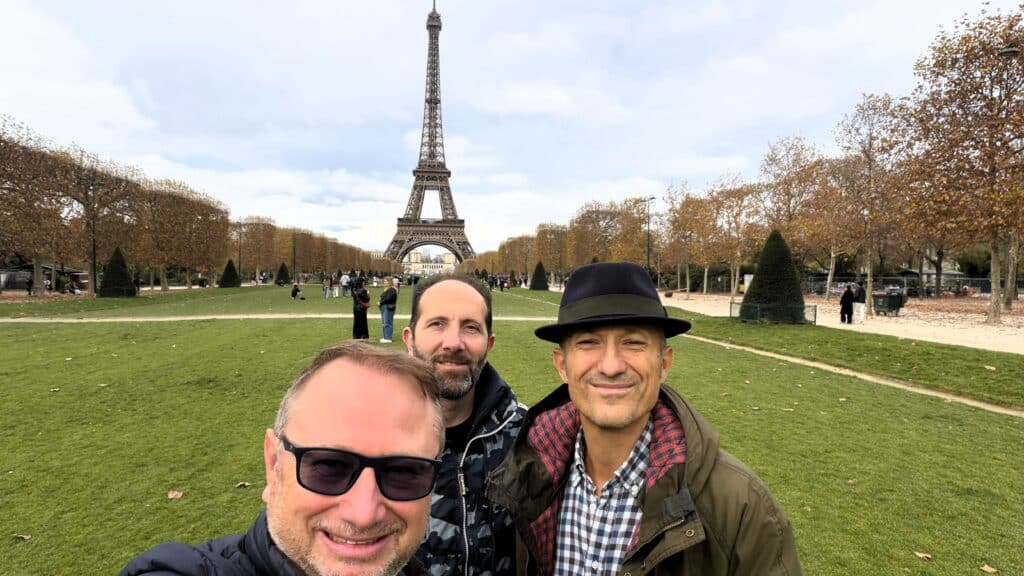 Gabriel and friends posing in the late autumn Champs de Mars Gardens in Paris, with the Eiffel Tower in the background.