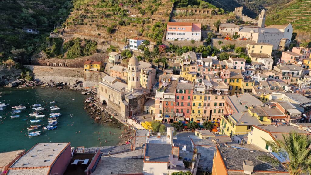 Vernazza Italy: A Gem of the Cinque Terre 6 Vernazza Italy harbor with colorful buildings and boats in the Cinque Terre region.