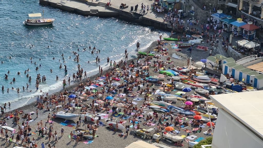 Top 6 Summer in Amalfi Coast best beaches 2 Amalfi Coast Beaches What to see Positano free beach crowded in August in the afternoon scaled