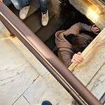 Interior view from the top of Brunelleschi's Dome, showing the hatch/trapdoor used to access the steep, narrow stairwell for the descent. Highlights the difficult nature of the Duomo climb in Florence.