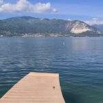 a dock on a lake. can you swim in lake maggiore
