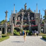 The famous Baroque Teatro Massimo Garden with its ornate statues and terraces on Isola Bella, a highlight of the Borromean Islands, Lake Maggiore, Italy. Ila, the author, standing on Isola Bella (Lake Maggiore), showcasing the stunning, picturesque scenery and the area's Instagrammable beauty.