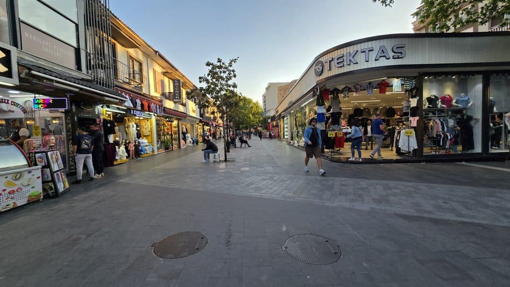 Elegantly arranged downtown shopping street in Kusadasi with local boutiques during a pleasant afternoon in May.