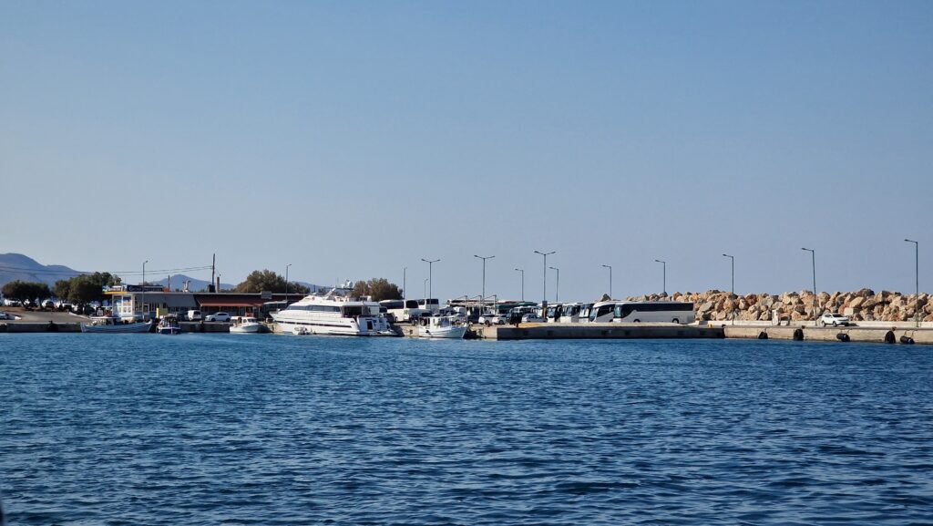 harbor of Kissamos where tours depart for Balos beach. Here we see the parked buses and the ticket office for the boat tours.