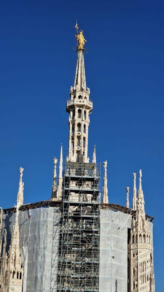 Things to do in Milan Terraces of the Cathedral on the Duomo rooftops higher point with the Madonna above it