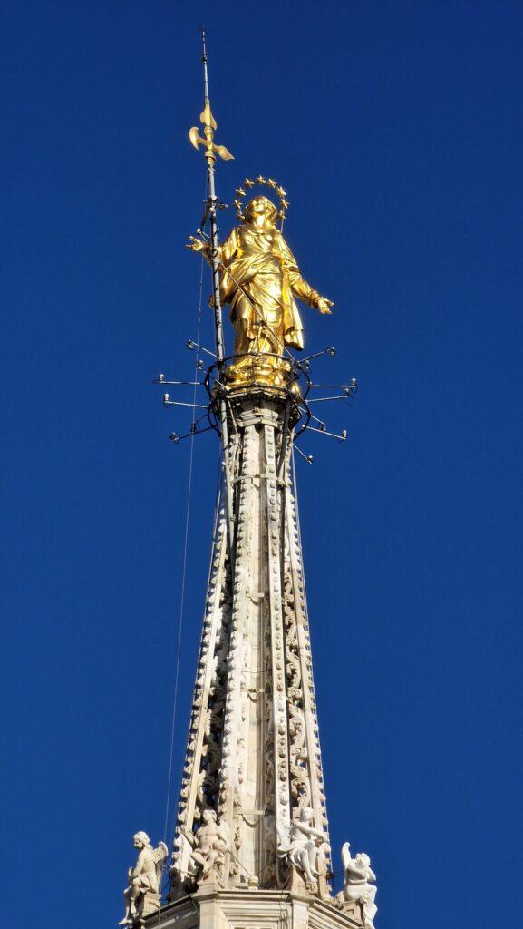 Things to do in Milan Terraces of the Cathedral on the Milano Duomo rooftops higher point with the Madonna above it 1