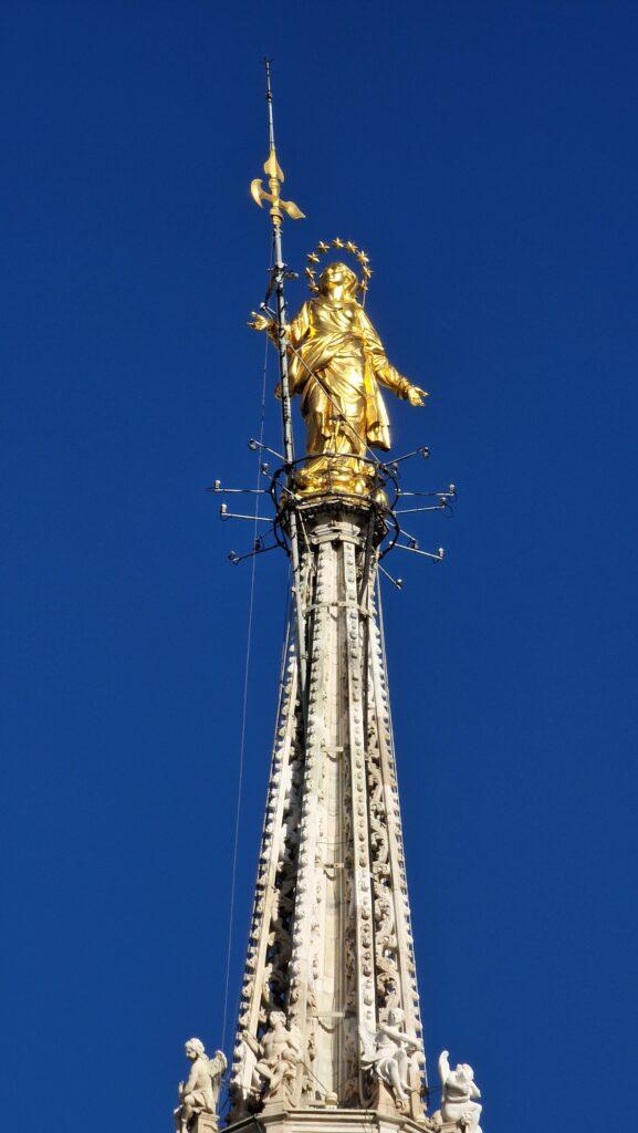 Things to do in Milan Terraces of the Cathedral on the Milano Duomo rooftops higher point with the Madonna above it 3