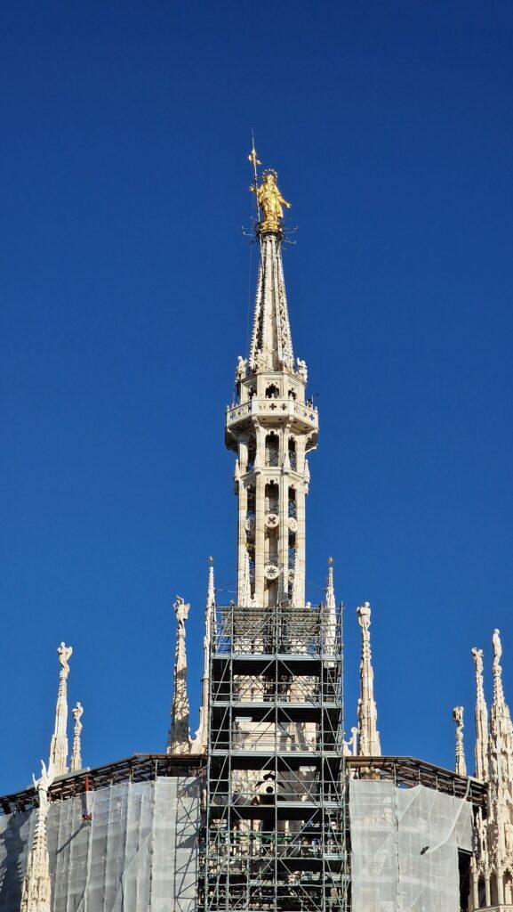 Things to do in Milan Terraces of the Cathedral on the Milano Duomo rooftops higher point with the Madonna above it 4