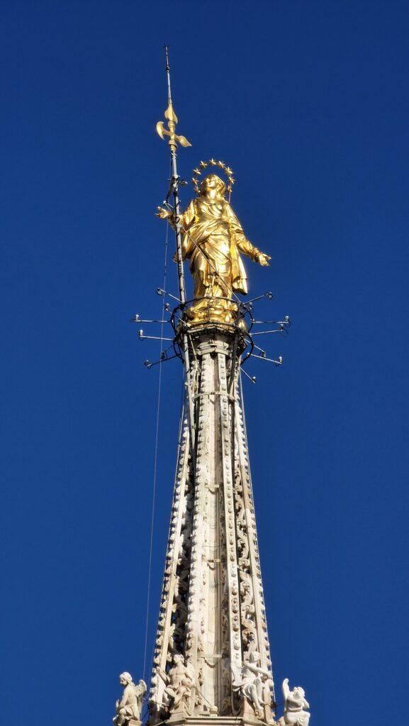 Things to do in Milan Terraces of the Cathedral on the Milano Duomo rooftops higher point with the Madonna above it 5