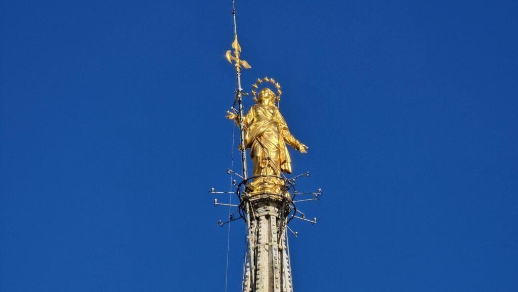 Things to do in Milan Terraces of the Cathedral on the Milano Duomo rooftops higher point with the Madonna above it 7